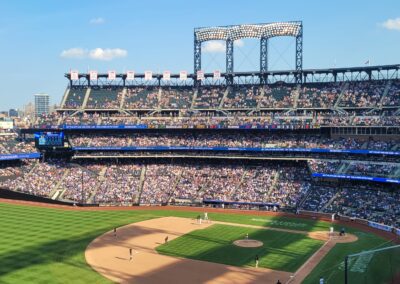 A baseball stadium with many fans in the stands.